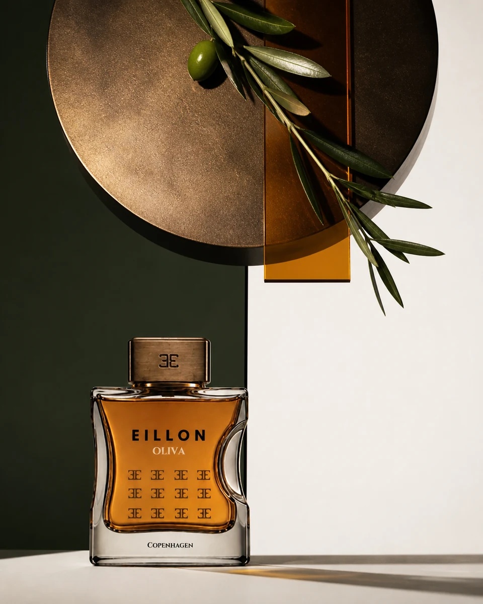 Oliva beneath a bronze monolith, live olive branch, and amber glass on split green and bone fields.